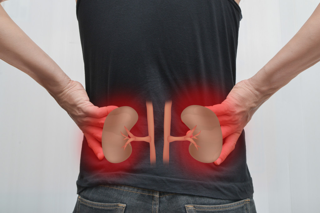 Person feeling pain in their kidneys
