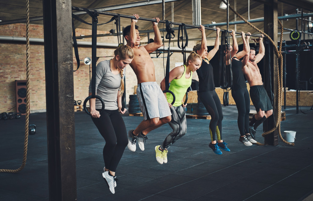 A group of people in a doing CrossFit training