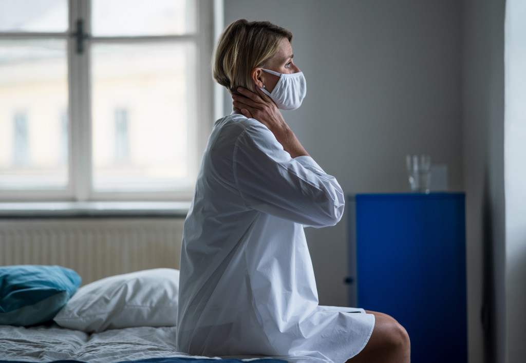 A woman recovering from COVID in a room