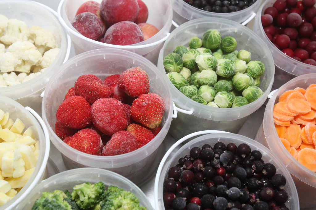summer fruits and veggies in plastic containers