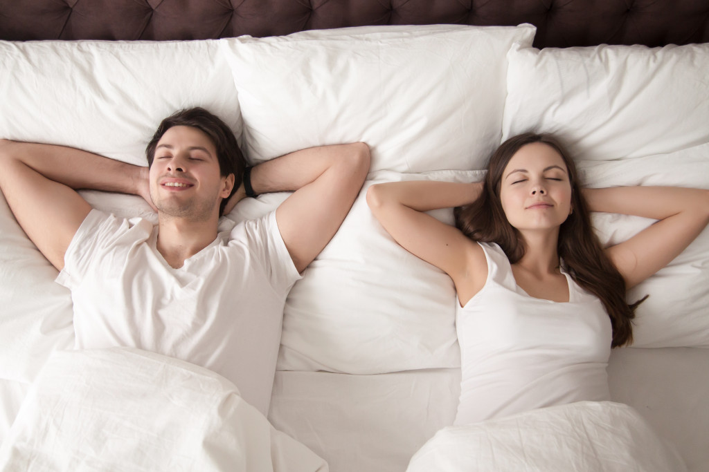 comfortable couple in bed relaxing